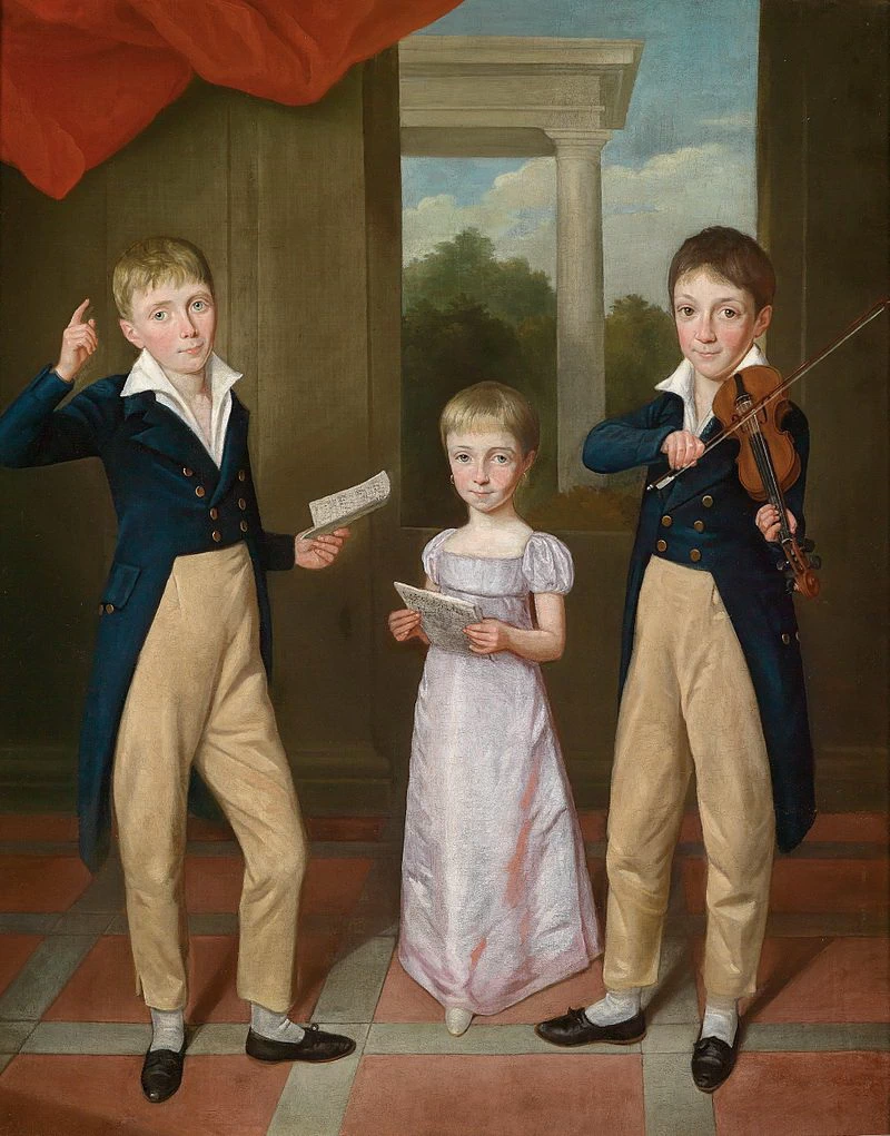  16-Un ritratto di una giovane ragazza e due ragazzi in un concerto in casa 